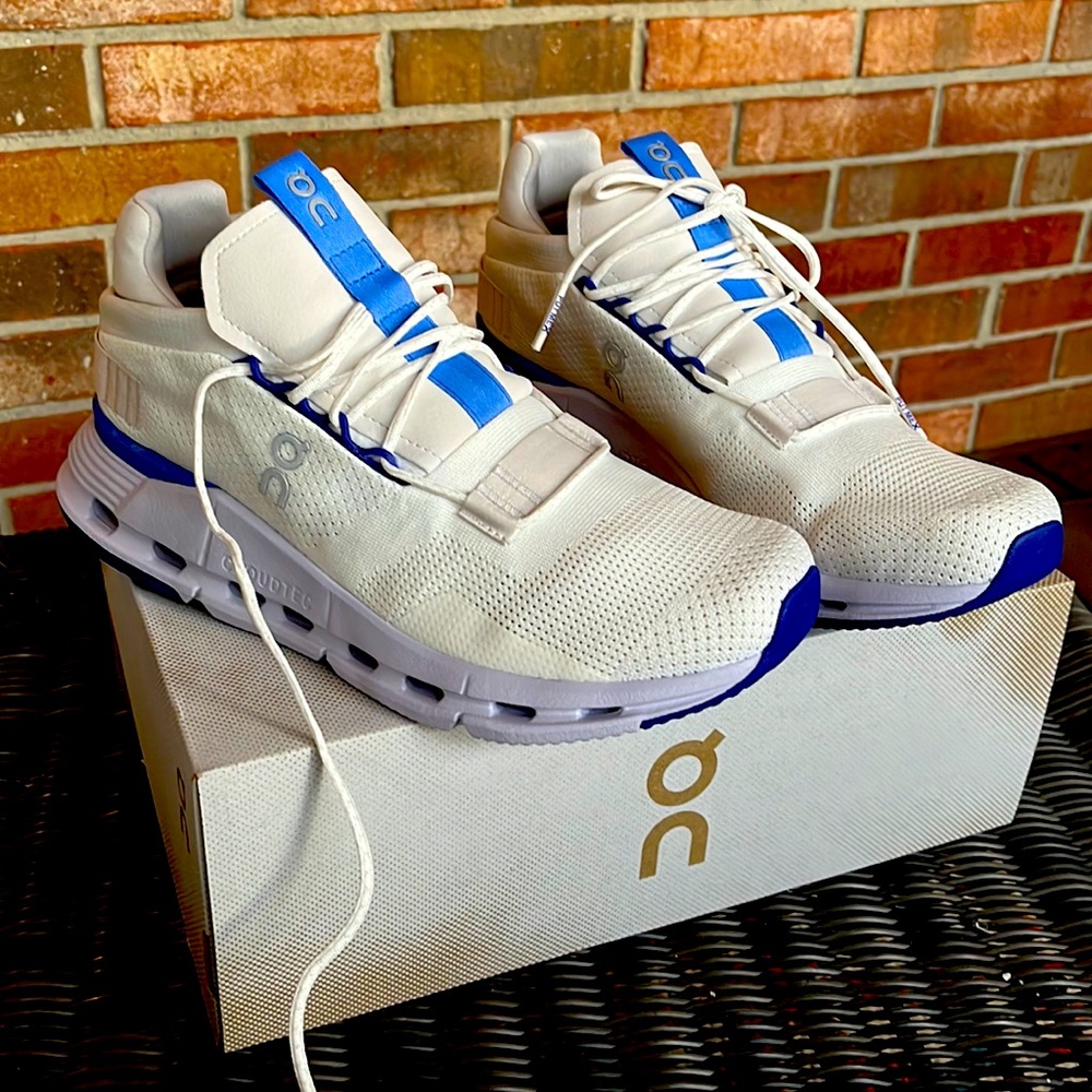 On Running White and Blue Athletic Shoes